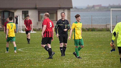 Liam McArthur refereeing the Westray v Stronsay match on Sunday 12th May, credit to Julian Preston.